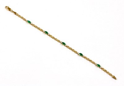 Lot 105 - A 9ct gold emerald and diamond bracelet