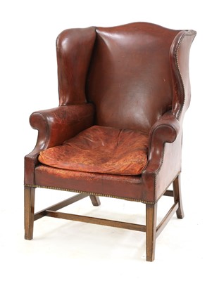Lot 340 - A George III-style red leather wingback armchair
