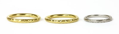 Lot 181 - A platinum hand engraved court section wedding ring