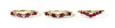 Lot 133 - A pair of 9ct gold ruby and diamond shaped rings