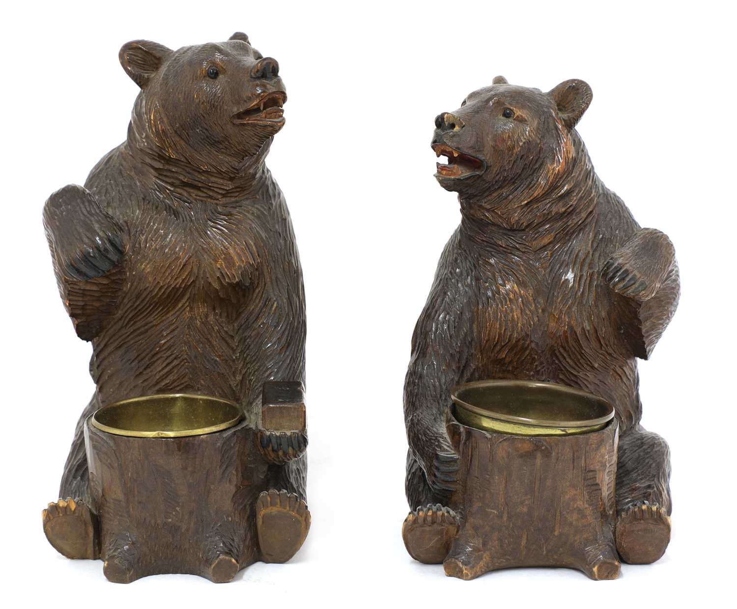 Lot 63 - A near opposing pair of carved Black Forest bear ashtrays