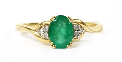 Lot 102 - A 9ct gold emerald and diamond ring