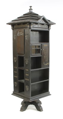 Lot 853 - An American 'Tabard Inn Library' ebonised oak revolving bookcase