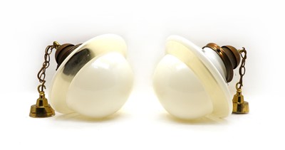 Lot 34 - A pair of brass and opaline pendant lights
