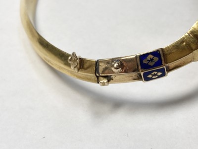 Lot 3 - A Swedish gold paste, split pearl and enamel hollow hinged bangle, c.1850