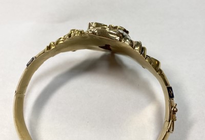 Lot 3 - A Swedish gold paste, split pearl and enamel hollow hinged bangle, c.1850