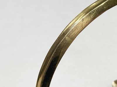 Lot 3 - A Swedish gold paste, split pearl and enamel hollow hinged bangle, c.1850