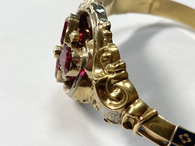 Lot 3 - A Swedish gold paste, split pearl and enamel hollow hinged bangle, c.1850