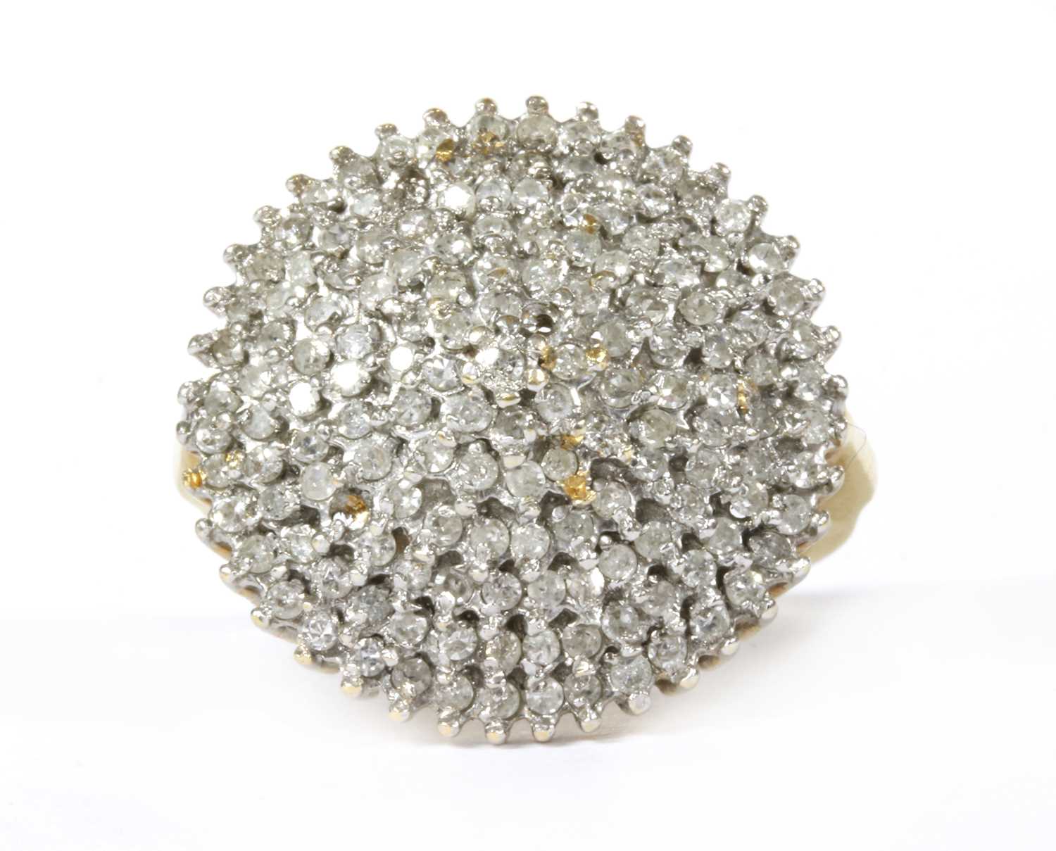 Lot 166 - An 18ct gold seven tier diamond set cluster ring
