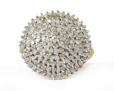 Lot 166 - An 18ct gold seven tier diamond set cluster ring