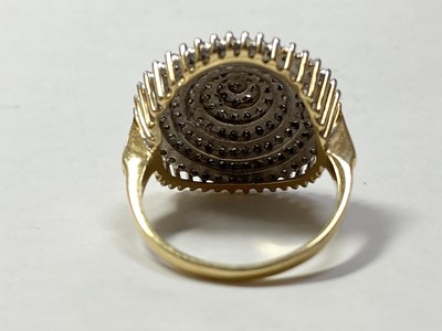 Lot 166 - An 18ct gold seven tier diamond set cluster ring