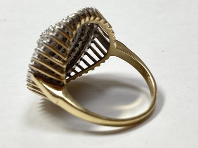 Lot 166 - An 18ct gold seven tier diamond set cluster ring