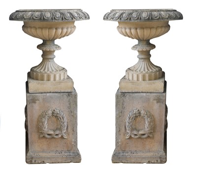 Lot 388 - A pair of blush terracotta garden urns