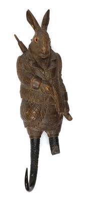 Lot 60 - A Black forest carved linden wood and horn musical hook