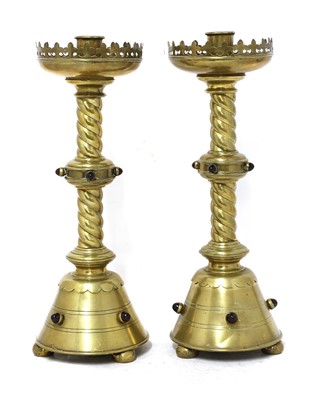 Lot 344 - A pair of brass ecclesiastical candlesticks