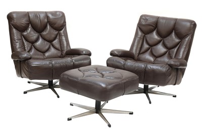 Lot 509 - A pair of chocolate brown lounge chairs