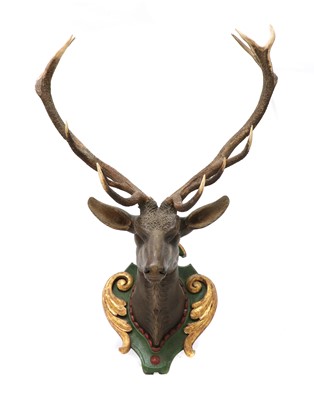 Lot 59 - A carved and polychrome painted wooden stag head