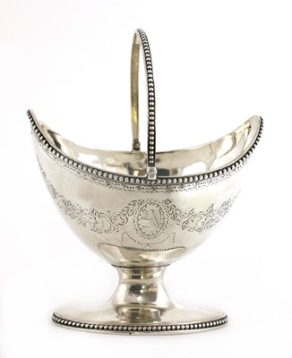 Lot 817 - A George III swing handle sugar basket