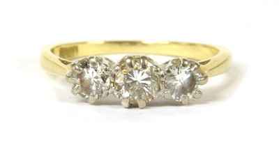 Lot 45 - A gold three stone diamond ring