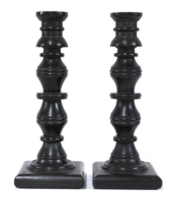 Lot 731 - A pair of coal candlesticks