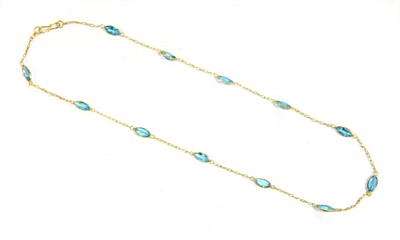 Lot 207 - A gold blue topaz rivière necklace