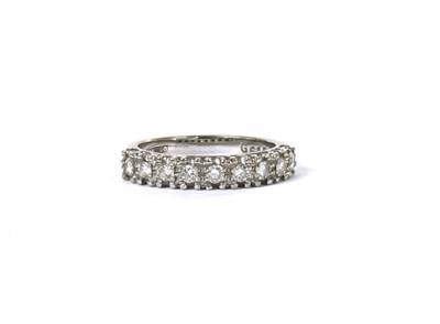 Lot 72 - A white gold nine stone diamond ring