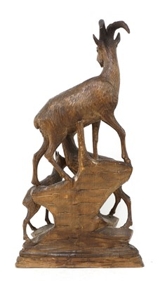 Lot 520 - A Black Forest carved linden wood figure group of mountain goats
