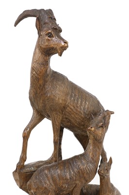 Lot 520 - A Black Forest carved linden wood figure group of mountain goats