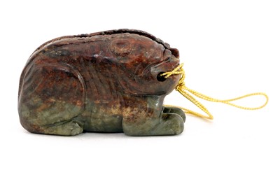 Lot 106 - A Chinese inscribed jade 'tiger' tally
