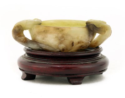 Lot 82 - A Chinese jade two-handled cup