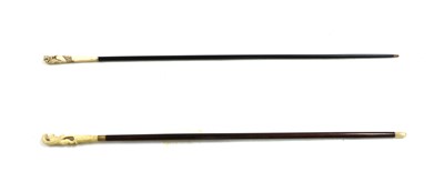 Lot 146 - A Japanese carved ivory handled walking cane