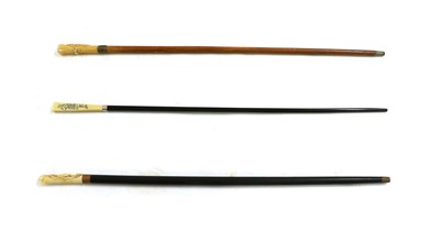 Lot 147 - A carved-ivory handled walking cane