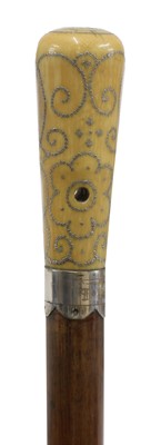 Lot 478 - A Queen Anne ivory and piqué work walking stick