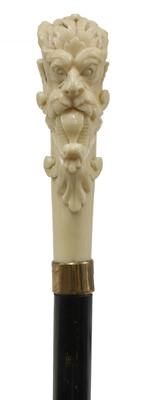 Lot 78 - An ivory and ebonised walking stick