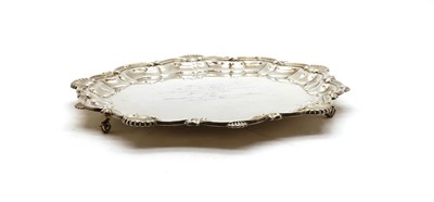 Lot 42 - A silver salver with C scroll shell border