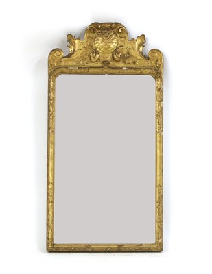 Lot 530 - A Queen Anne carved giltwood and gesso pier mirror