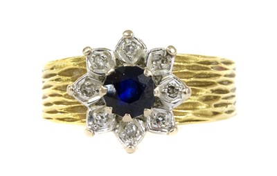 Lot 138 - A gold sapphire and diamond flower cluster ring, c.1980