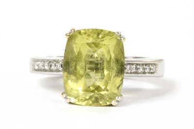 Lot 283 - A gold heliodor and diamond ring