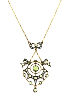 Lot 171 - A silver and gold, peridot and diamond pendant