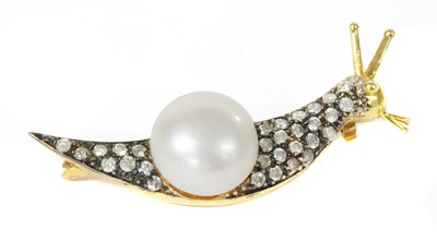 Lot 210 - A silver cultured freshwater pearl and diamond snail brooch