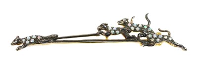 Lot 204 - A silver opal and diamond set hunting scene brooch