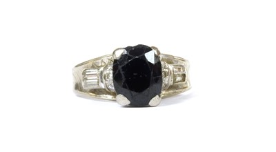 Lot 129 - A white gold sapphire and diamond ring