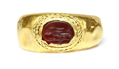 Lot 5 - A Roman gentlemen's high carat gold cornelian intaglio ring