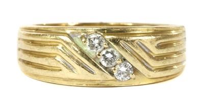 Lot 49 - A gold three stone diamond ring