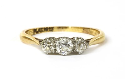 Lot 48 - A gold three stone diamond ring