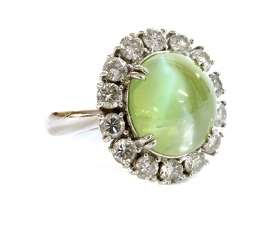 Lot 339 - A platinum, chrysoberyl cat's eye and diamond oval cluster ring