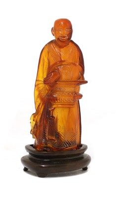 Lot 239 - A Chinese amber carving