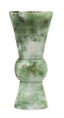Lot 63 - A Chinese jade gu vase