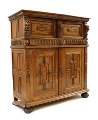 Lot 373 - A panelled oak court cupboard