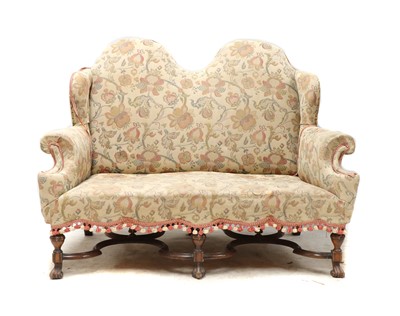 Lot 244 - A carved walnut framed settee